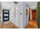 Hallway featuring stone floors, wooden doors, and natural accents at 36607 E Eldorado Lake Dr, Eustis, FL 32736
