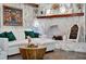 Comfortable living room features fireplace, stone walls, and modern decor at 36607 E Eldorado Lake Dr, Eustis, FL 32736