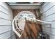 Unique spiral staircase with wood flooring, white railings, and a skylight above, creating a focal point at 36607 E Eldorado Lake Dr, Eustis, FL 32736