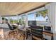 The sun room has picturesque views of the lake from large windows at 36607 E Eldorado Lake Dr, Eustis, FL 32736