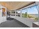 Sun room featuring water views, a treadmill and space for leisure at 36607 E Eldorado Lake Dr, Eustis, FL 32736