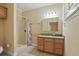 Bathroom featuring granite counters, a shower, and tile floors at 4200 Joslyn Ln, Lady Lake, FL 32159