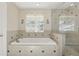 Bathroom featuring a soaking tub and separate glass shower at 4200 Joslyn Ln, Lady Lake, FL 32159