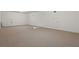 Expansive carpeted bonus room with neutral tones, offering versatile space for recreation or storage at 4200 Joslyn Ln, Lady Lake, FL 32159