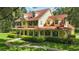 Stunning yellow two-story home featuring a charming wrap-around porch and verdant landscaping at 4200 Joslyn Ln, Lady Lake, FL 32159