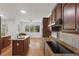 Gourmet kitchen with granite countertops, stainless steel appliances, and hardwood floors at 4200 Joslyn Ln, Lady Lake, FL 32159