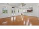 Bright living room with hardwood floors and natural light from sliding glass doors at 4200 Joslyn Ln, Lady Lake, FL 32159