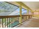 An expansive screened in patio with a view of the pool and landscaping at 4200 Joslyn Ln, Lady Lake, FL 32159