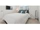 Bright and airy bedroom with large bed, light walls, and flat screen television at 464 W Plant St, Winter Garden, FL 34787