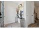 Elegant entryway with modern console table and stylish decor, offering a glimpse of the staircase at 464 W Plant St, Winter Garden, FL 34787