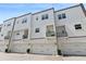 Modern townhome exterior with balconies and attached garages at 464 W Plant St, Winter Garden, FL 34787