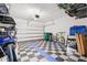 Garage with checkered floors and overhead storage at 464 W Plant St, Winter Garden, FL 34787