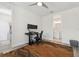Office space with modern desk, ceiling fan, and wood-look flooring at 464 W Plant St, Winter Garden, FL 34787