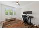 Office space with modern desk, windows, and neutral-toned accents at 464 W Plant St, Winter Garden, FL 34787