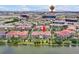 Stunning aerial view of a multi-Gathering dwelling near a lake and Epic Universe in Orlando, Florida at 5024 Shoreway Loop # 10106, Orlando, FL 32819