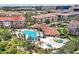 Resort-style community pool with lounge chairs, water features, and lush landscaping at 5024 Shoreway Loop # 10106, Orlando, FL 32819