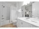 Bright bathroom features a shower-tub combo, white vanity and tile flooring at 5024 Shoreway Loop # 10106, Orlando, FL 32819