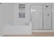 Well-maintained bathroom featuring a soaking tub and a separate glass-enclosed shower at 5024 Shoreway Loop # 10106, Orlando, FL 32819
