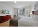 Relaxing bedroom with television, large window, and dresser at 5024 Shoreway Loop # 10106, Orlando, FL 32819