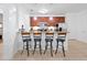 Open kitchen with counter seating, granite countertops, and stainless steel appliances at 5024 Shoreway Loop # 10106, Orlando, FL 32819