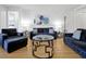 Comfortable living room featuring stylish furniture and a chic, glass-topped coffee table at 5024 Shoreway Loop # 10106, Orlando, FL 32819