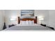 Comfortable bedroom with decorative headboard, accent lamps, and soft bedding at 5024 Shoreway Loop # 10106, Orlando, FL 32819