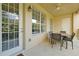 Enjoy al fresco dining on the covered patio featuring a table, chairs, and ceiling fan at 5024 Shoreway Loop # 10106, Orlando, FL 32819