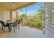 Relaxing outdoor patio with a dining table and chairs, offering a pleasant view at 5024 Shoreway Loop # 10106, Orlando, FL 32819