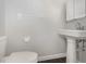 Clean bathroom with pedestal sink, tile floors, and a minimalist design at 546 Northbridge Dr, Altamonte Springs, FL 32714