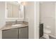 A well-lit bathroom with gray cabinets and granite countertops offers a pleasant experience at 546 Northbridge Dr, Altamonte Springs, FL 32714