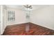 Bedroom has hardwood floors, a ceiling fan with lighting and natural lighting from two windows at 546 Northbridge Dr, Altamonte Springs, FL 32714