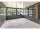 An enclosed porch with multiple windows provides natural lighting and views of greenery at 546 Northbridge Dr, Altamonte Springs, FL 32714