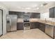 Well-equipped kitchen features stainless steel appliances, granite countertops, and tile flooring at 546 Northbridge Dr, Altamonte Springs, FL 32714