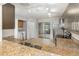 The kitchen features stainless steel appliances, granite countertops, and a view of the backyard at 546 Northbridge Dr, Altamonte Springs, FL 32714