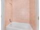 A tiled bathtub and shower features bright tiles and good lighting at 546 Northbridge Dr, Altamonte Springs, FL 32714