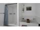 Bright bathroom with a tub and shower combination with a full tile surround, creating a spa-like ambiance at 5929 Hatteras Dr, Port Orange, FL 32127