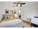 Bedroom with ceiling fan, natural light, desk, and decor at 5929 Hatteras Dr, Port Orange, FL 32127