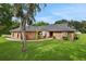 Beautiful single-story brick home with mature landscaping at 5929 Hatteras Dr, Port Orange, FL 32127