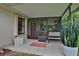 Charming patio area featuring outdoor seating and potted plants, creating a cozy and inviting space at 5929 Hatteras Dr, Port Orange, FL 32127