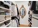 Well-organized walk-in closet featuring built-in shelving and hanging rods to maximize storage space at 5929 Hatteras Dr, Port Orange, FL 32127
