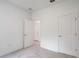 Bedroom showcasing two doors, carpet, neutral walls, and natural light at 6929 Sw 130Th Lane Rd, Ocala, FL 34473