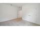 Bedroom featuring neutral walls and carpet, with closet space and doorways visible at 6929 Sw 130Th Lane Rd, Ocala, FL 34473