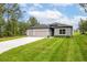 Lovely single-story home with a well-manicured lawn and a spacious driveway at 6929 Sw 130Th Lane Rd, Ocala, FL 34473