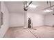 Large, unfinished garage with a water heater and ample space for storage or projects at 6929 Sw 130Th Lane Rd, Ocala, FL 34473