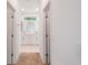 Hallway view of a bathroom with double vanity and white marble countertop, seamlessly connecting to the bedroom at 6929 Sw 130Th Lane Rd, Ocala, FL 34473