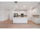 Modern kitchen with a large island, stainless steel appliances, and bright white cabinetry at 6929 Sw 130Th Lane Rd, Ocala, FL 34473