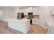 Spacious kitchen featuring a large island, modern appliances, and ample white cabinetry for storage at 6929 Sw 130Th Lane Rd, Ocala, FL 34473
