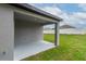 View of the covered patio, great for outdoor relaxation and entertaining, with view of fenced yard at 6929 Sw 130Th Lane Rd, Ocala, FL 34473