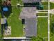Aerial view of backyard, shed, patio, house, fence, and other buildings at 7033 Lakner Way, Orlando, FL 32822
