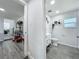 Bathroom with white vanity, toilet, and window with lots of natural light at 7033 Lakner Way, Orlando, FL 32822